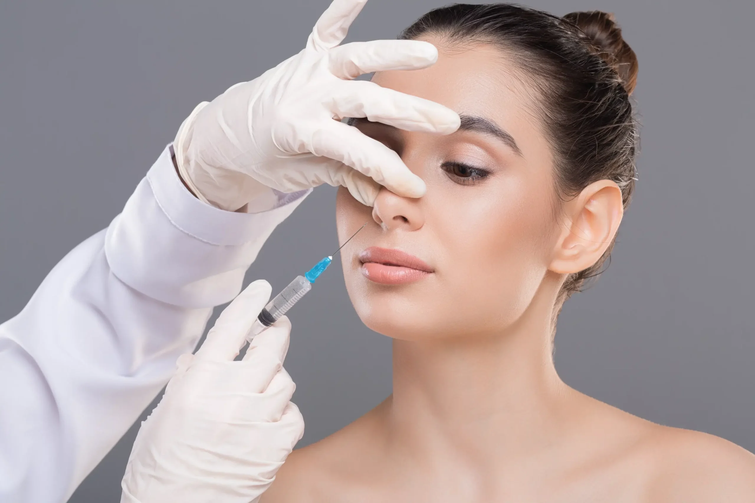 Doctor injecting nose fillers singapore